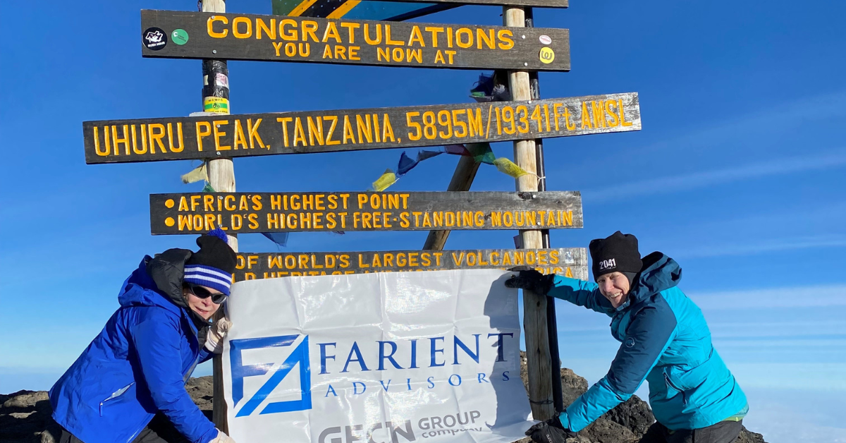 Robin Ferracone and Randi Caplan of Farient Advisors at the peak of Mount Kilimanjaro