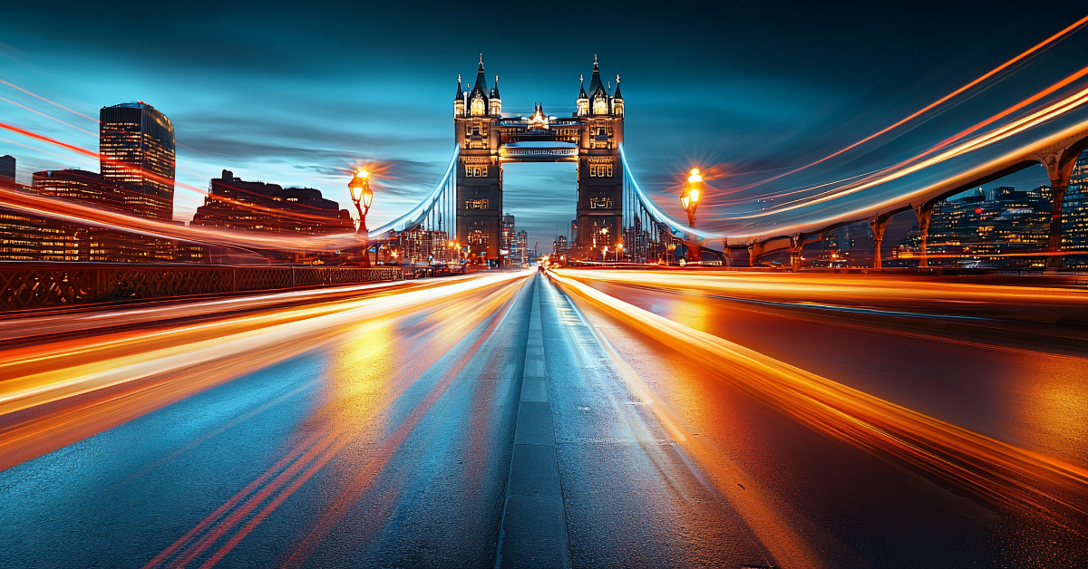 Night cityscape with light trails on a bridge towards Tower Bridge