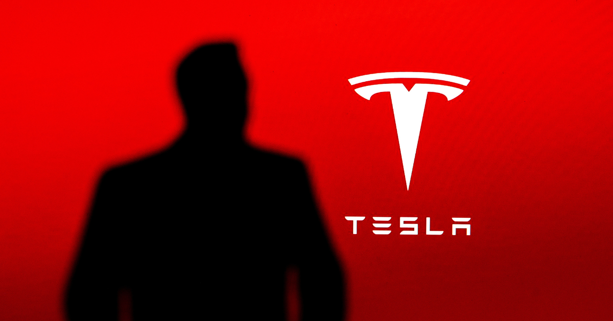 Silhouette of business magnate and investor looked like Elon Musk, Tesla Company logo in background