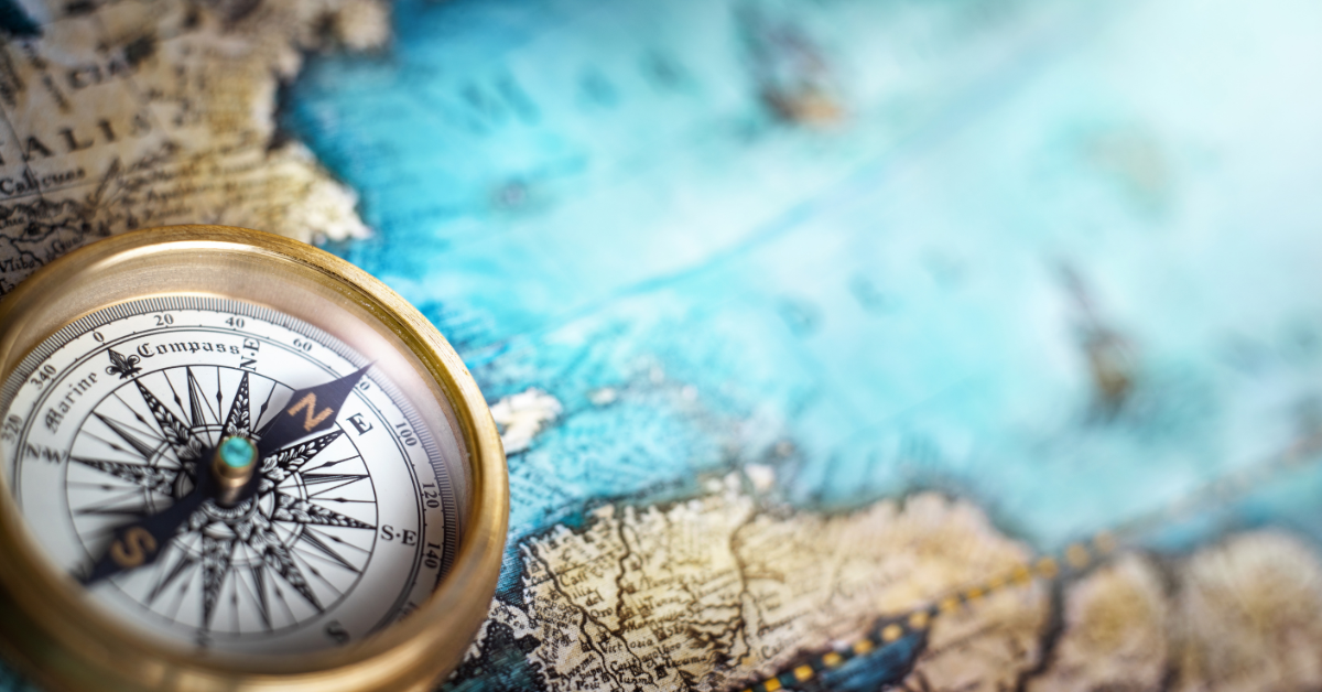 Magnetic compass on world map