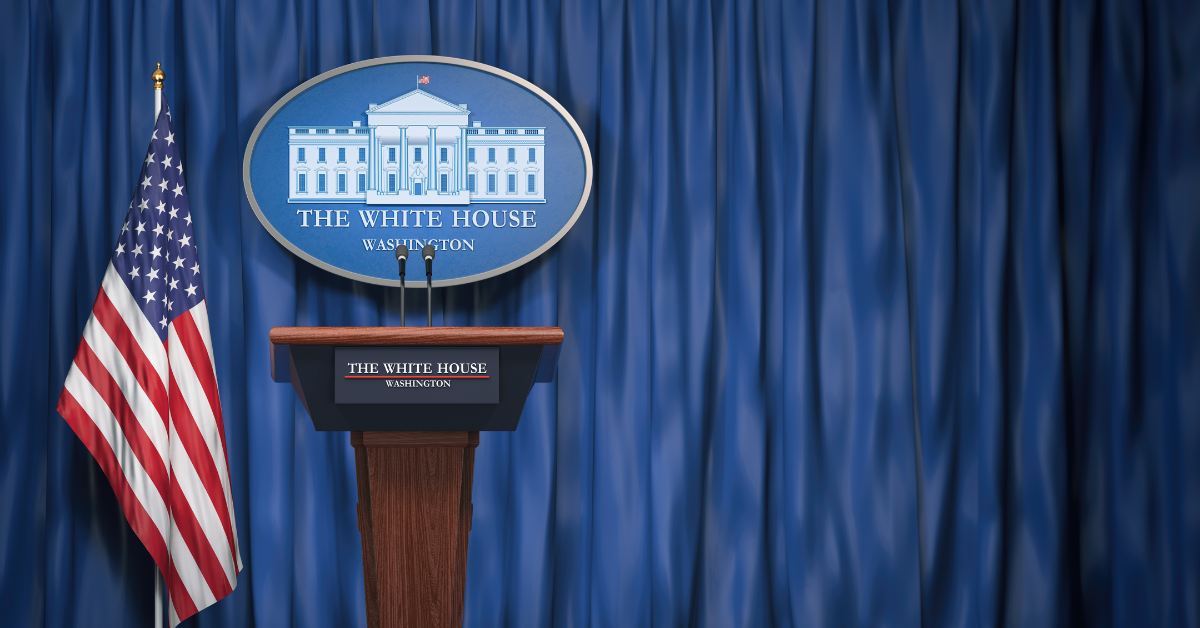 Podium speaker tribune with USA flags and sign of White House with space for text. Briefing of president of US United States in White House.