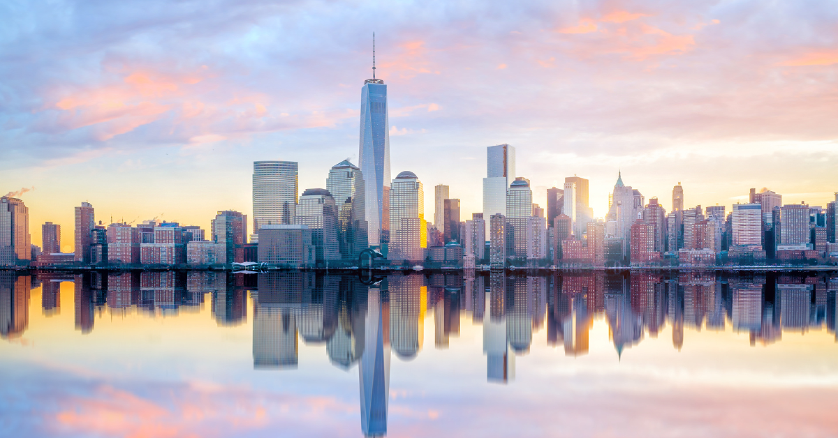 Manhattan Skyline with the One World Trade Center building at twilight