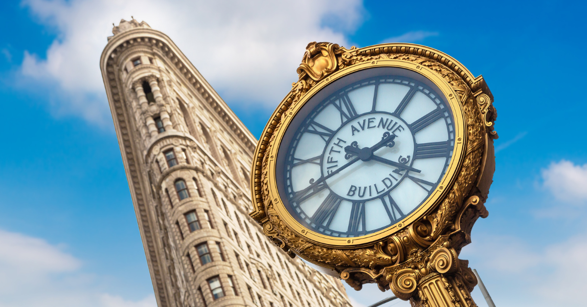 Clock and Flatiron Building in New York