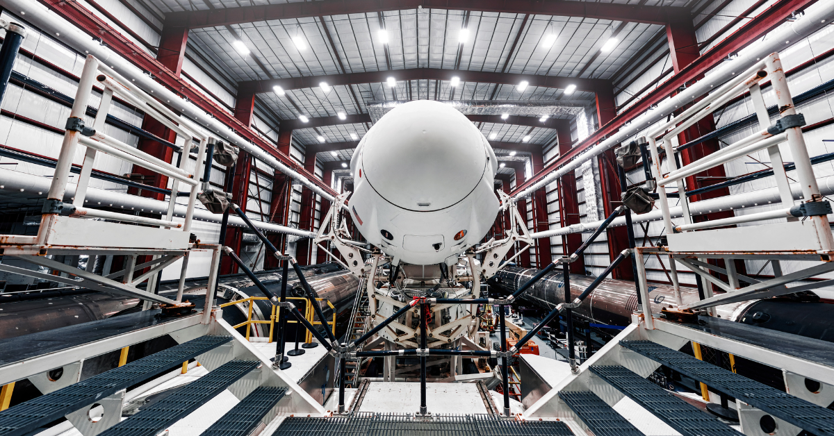 Space launch preparation. Spaceship SpaceX Crew Dragon, atop the Falcon 9 rocket, inside the hangar , just before rollout to the launchpad. Elements of this image furnished by NASA