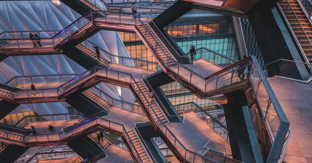 intricate staircases of The Vessel in Hudson Yards, New York City, signifying the intricacies of pay disclosures