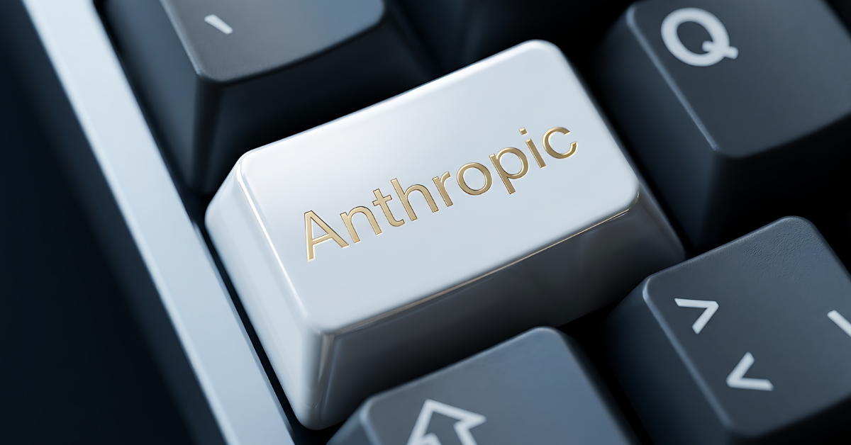 Close-up of a white keyboard with the word Anthropic written in gold on a prominent key, symbolizing technology and artificial intelligence.